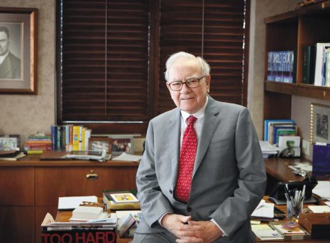 Warren Buffet at his desk in Omaha