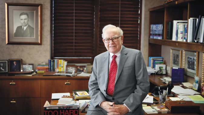 Warren Buffet at his desk in Omaha
